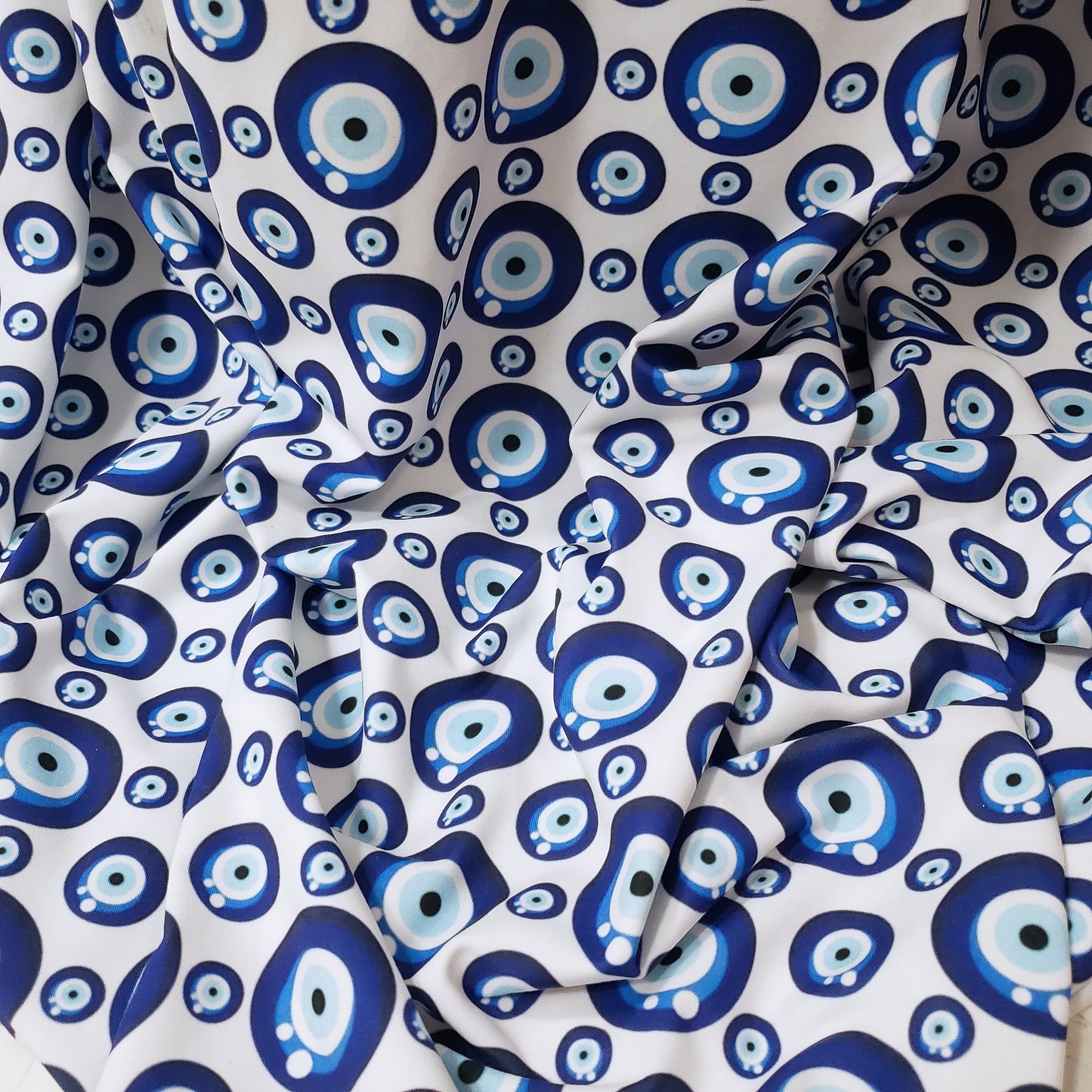 Evil Eye Nazar Print Fabric – Navy, Royal & Light Blue Eyes on White 4-way Stretch Poly Spandex