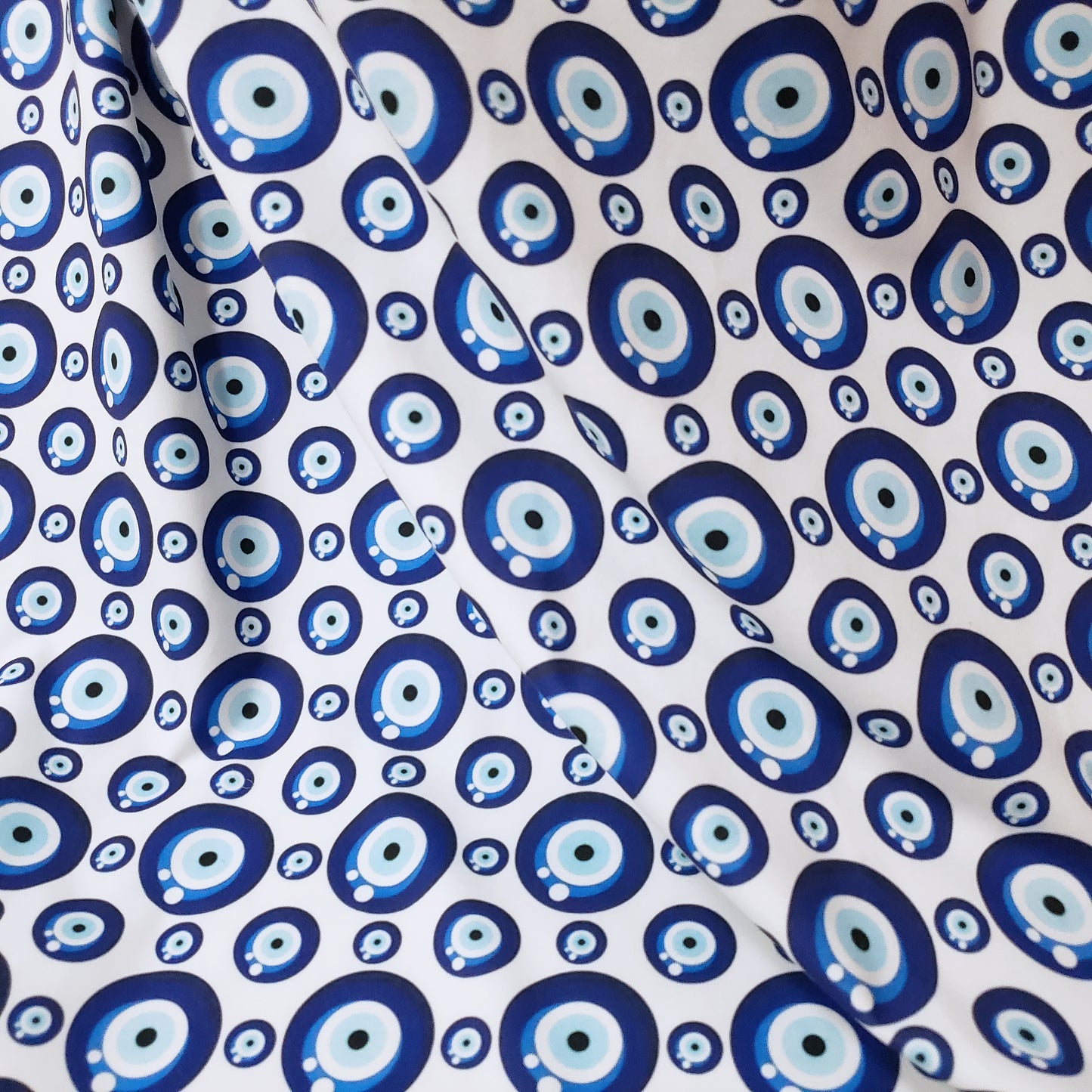 Evil Eye Nazar Print Fabric – Navy, Royal & Light Blue Eyes on White 4-way Stretch Poly Spandex
