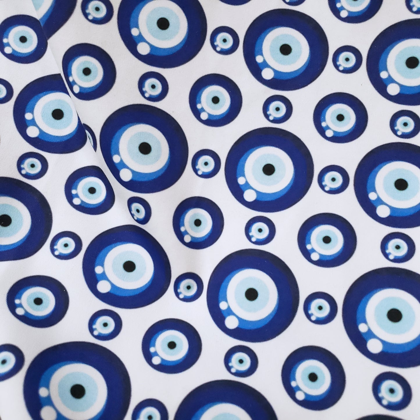 Evil Eye Nazar Print Fabric – Navy, Royal & Light Blue Eyes on White 4-way Stretch Poly Spandex
