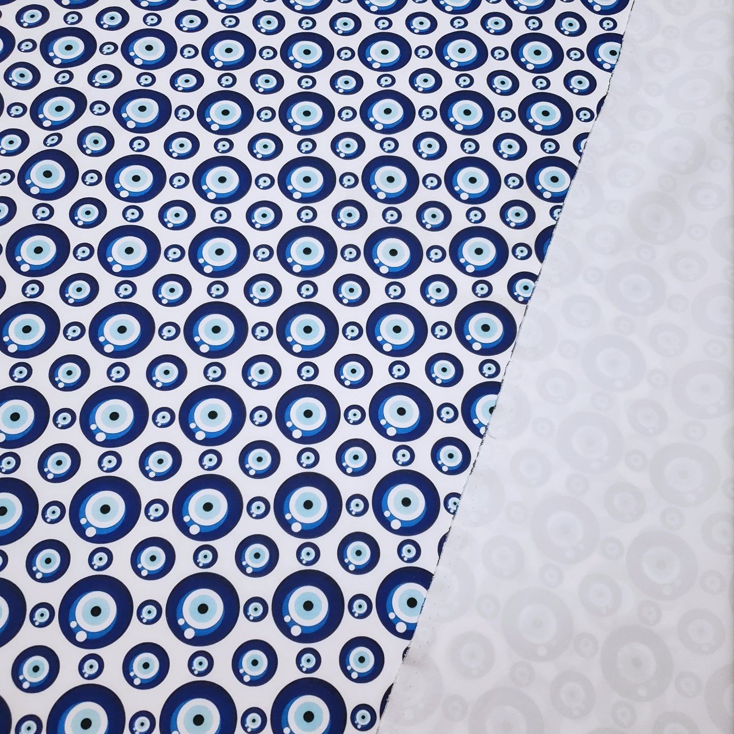 Evil Eye Nazar Print Fabric – Navy, Royal & Light Blue Eyes on White 4-way Stretch Poly Spandex
