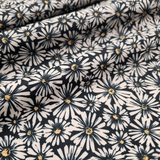 Wild Daisies on Black Print Nylon Spandex Fabric Recycled Interlock Sport
